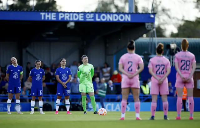 Players line up in the centre circle