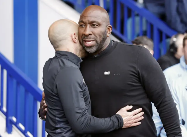 Derby boss Paul Warne embraces Sheffield Wednesday counterpart Darren Moore