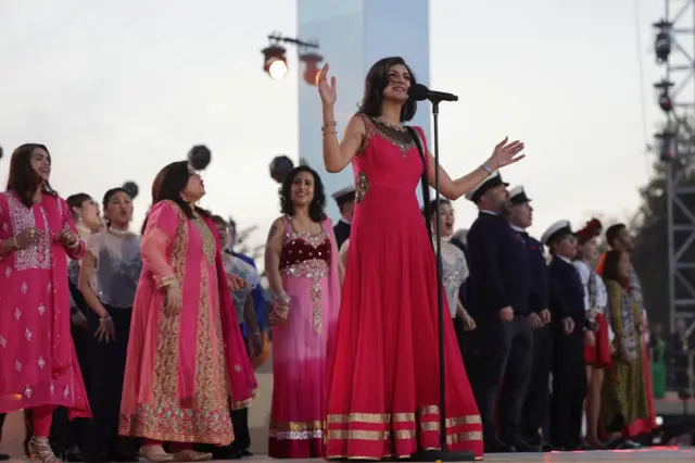 The Coronation Choir performs on stage