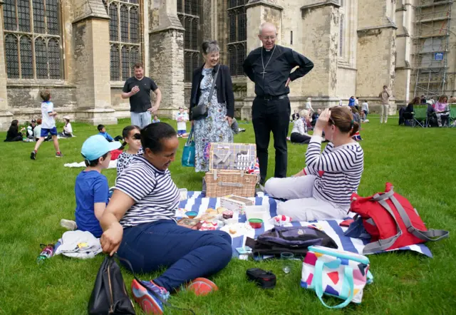 Archbishop of Canterbury Justin Welby and his wife Caroline attending the Big Lunch in the grounds Canterbury Cathedral, Kent.