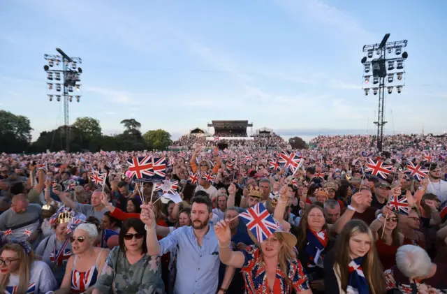 Members of the public are seen ahead of the Coronation Concert in Windsor Castle