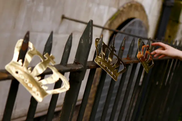 A person sets up decorations for a party in St James Church