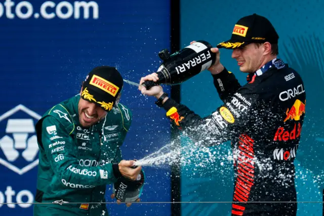 Fernando Alonso and Max Verstappen spray champagne