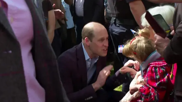 Prince William meets a young girl