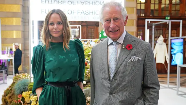 King Charles stands next to fashion designer and sustainability advocate Stella McCartney as he views a fashion installation by the designer, at the Kelvingrove Art Gallery and Museum, during the UN Climate Change Conference (COP26), in Glasgow, Scotland, Britain November 3, 2021