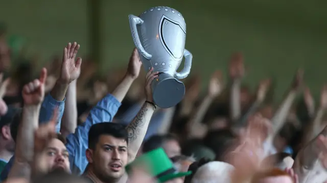 Plymouth fans with an inflatable trophy