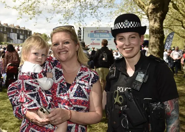 a woman and a child with a police officer