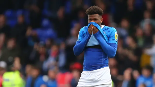 Stockport's Myles Hippolyte looks dejected