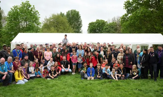 Members of the Royal Family pose with volunteers