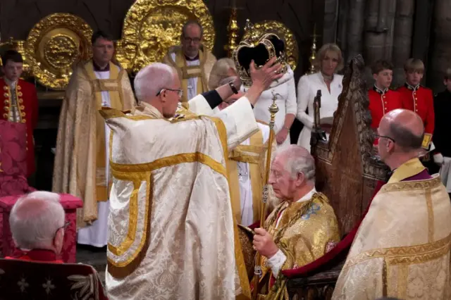 King Charles III is crowned with St Edward's Crown by The Archbishop of Canterbury the Most Reverend Justin Welby during his coronation ceremony in Westminster Abbey, London.