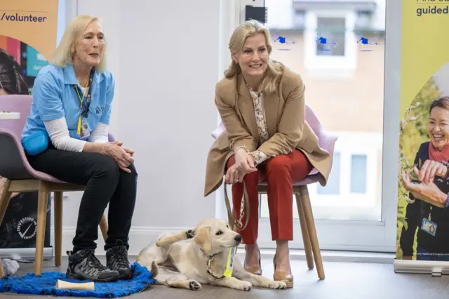 Sophie with a guide dog in Reading