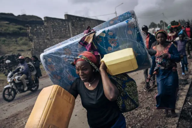 War-displaced people flee towards the city of Goma, eastern Republic of Congo, on November 15, 2022