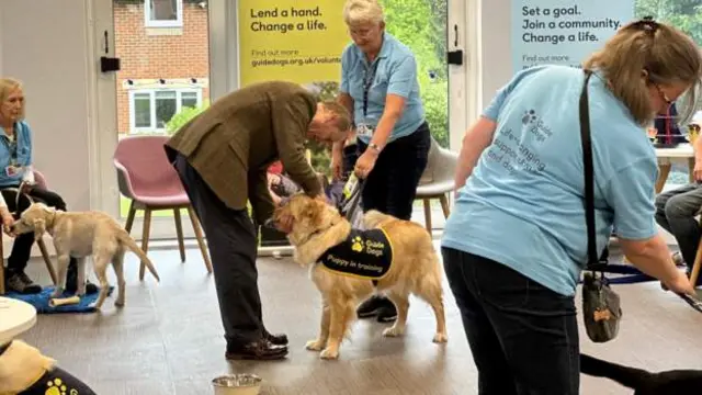 Prince Edward with a guide dog