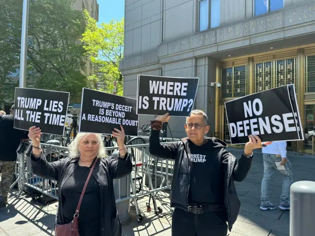 A few protestors gathered outside the New York City courthouse as closing arguments are underway