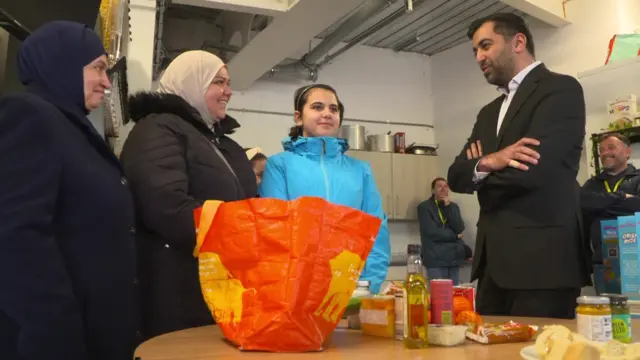 Humza Yousaf chats to members of the public during a volunteering event in Dundee