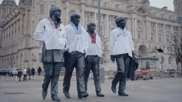 Beatles statues with Ukrainian shirts on