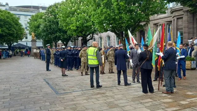 Military members join together outside States building