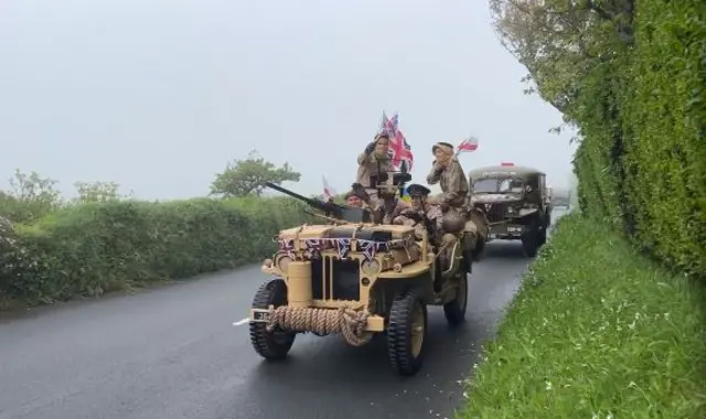 Military vehicles adorned with flags in Guernsey