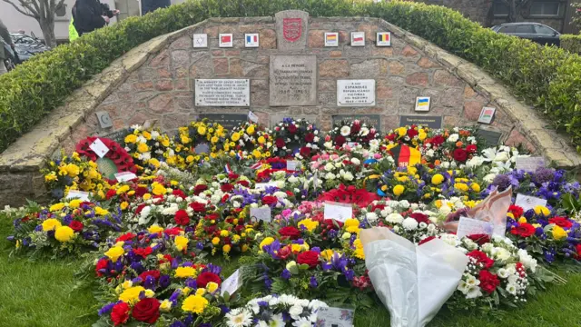 Floral tributes at slave memorial