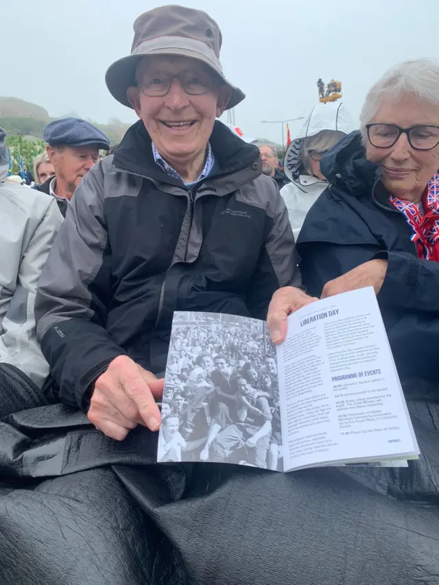 Robb pointing to father in programme at Liberation Square