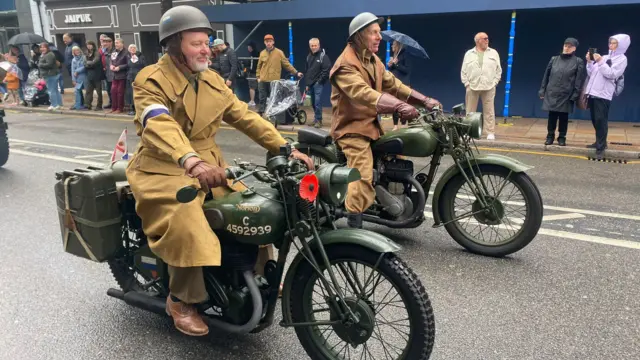 Two men on motorbikes