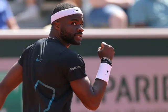 Frances Tiafoe celebrates