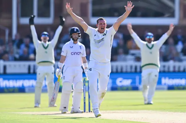 Ireland's Graham Hume (C) appeals unsuccessfully for the wicket of England's Ben Duckett during day 1 of the Test match between England and Ireland at the Lord's cricket ground in London