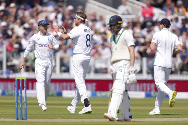 England's Stuart Broad celebrates after taking the wicket of Ireland's James McCollum