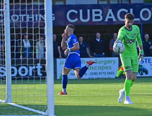 Ethan McGee celebrates scoring the opener at Stangmore Park