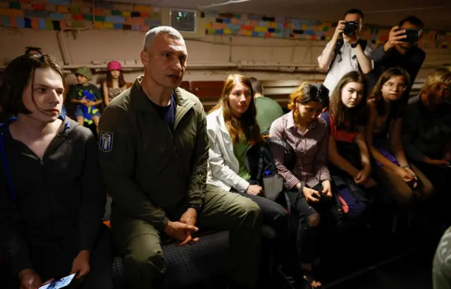 Mayor of Kyiv Vitali Klitschko takes cover inside shelter with local residents