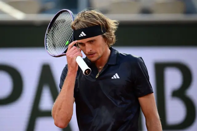 Alexander Zverev scratches his forehead