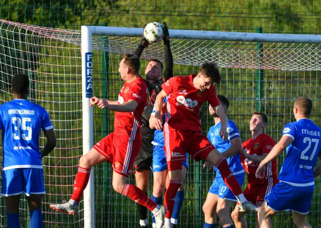 Swifts keeper Declan Dunne leaps to catch the ball in the first leg