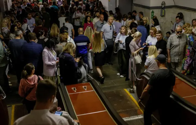 People take cover inside a subway station during an air raid alert, amid Russia's attack on Ukraine, in Kyiv, Ukraine, June 1, 2023