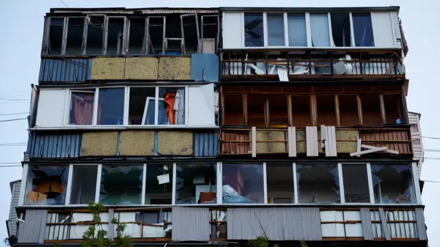 A view of a residential building damaged in a missile strike