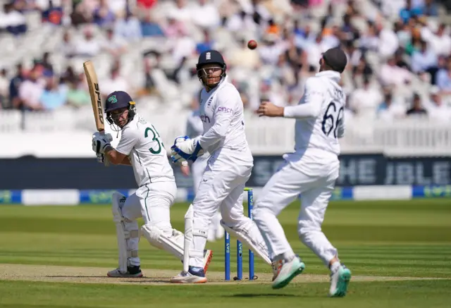 England's Joe Root attempts to take a catch in the slips off the bat of Ireland's Andy McBrine during day one of the first LV= Insurance Test match at Lord's, London