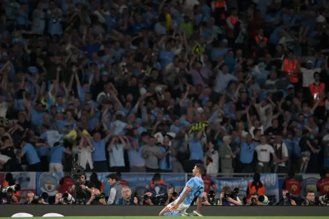 Rodri celebrates in front of the Man City fans