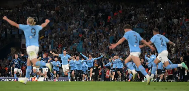 Man City players and staff celebrate