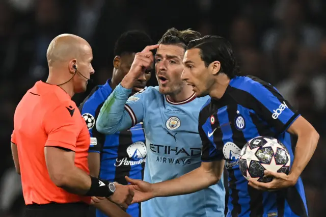 Jack Grealish (centre) and Matteo Darmian (right) remonstrate with the referee