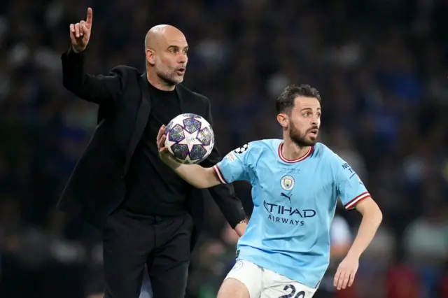 Pep Guardiola and Bernardo Silva