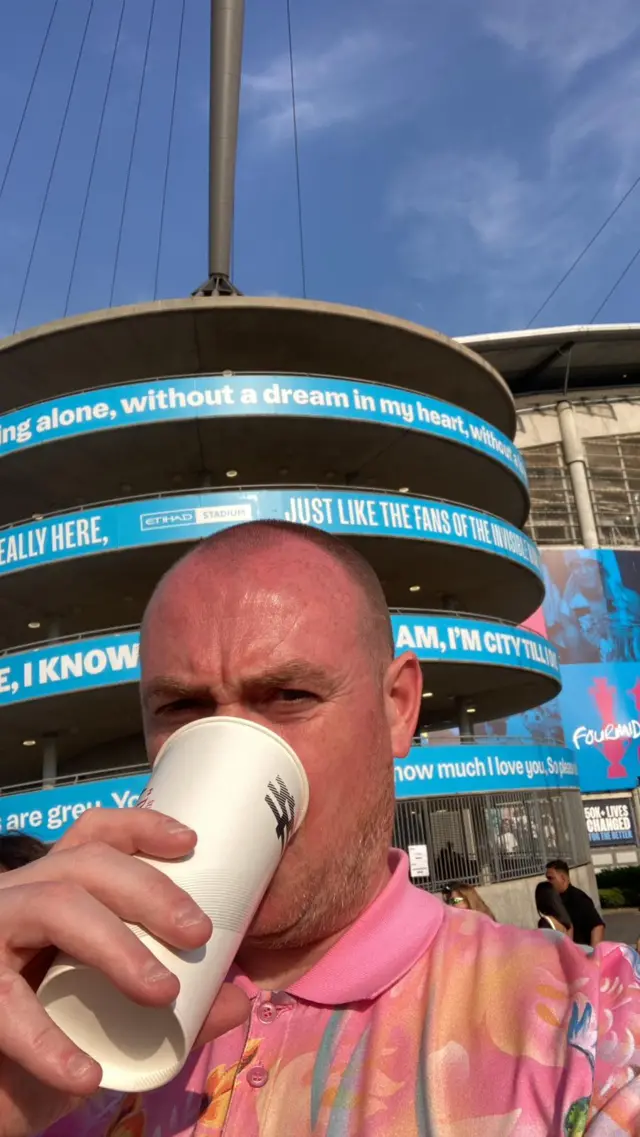 Man outside Etihad stadium