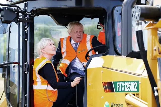 Boris Johnson and Nadine Dorries drive a digger