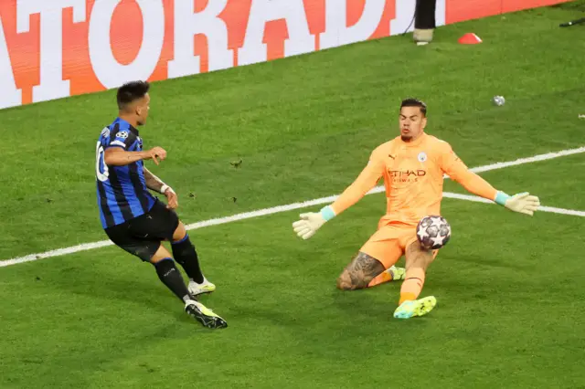 Ederson saves a shot by Lautaro Martinez