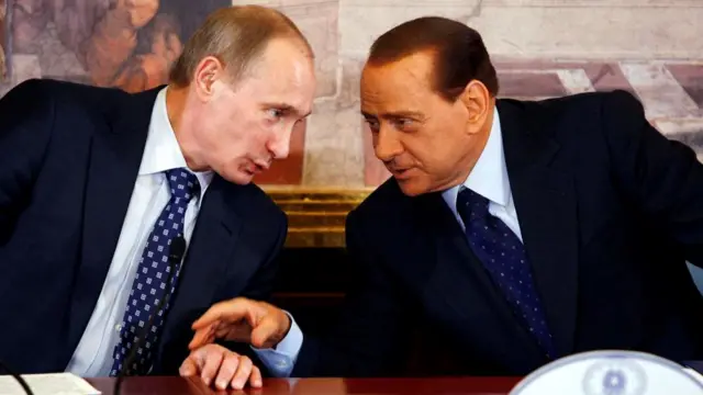 Vladimir Putin speaks to Silvio Berlusconi in 2010