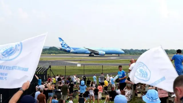 Man City fans welcome the team home