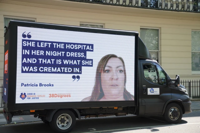 A billboard reading "She left the hospital in her nightdress and that is what she was cremated in"