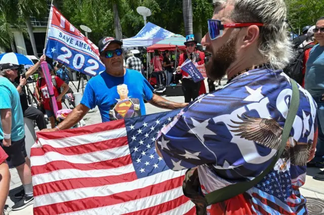 Protestors gather outside a Miami courthouse the day of Donald Trump's arraignment