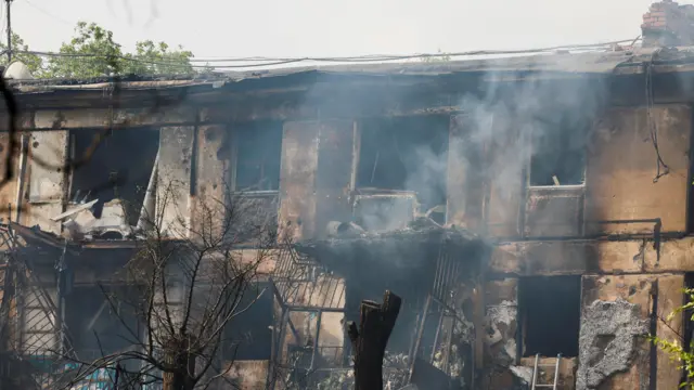 A view of a residential building heavily damaged by a Russian missile strike