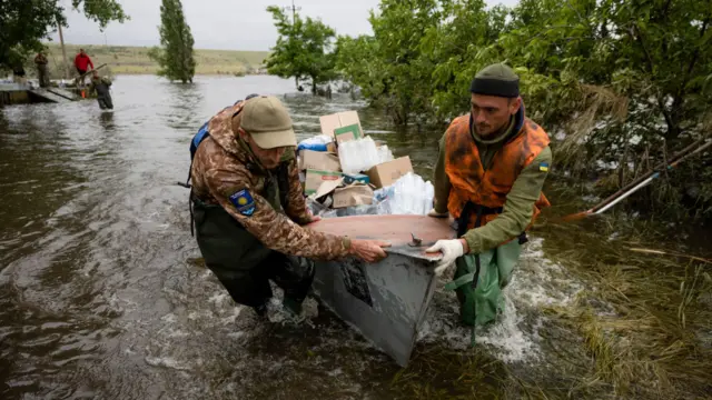 Volunteers deliver humanitarian aid to local residents in the village of Afanasiivka, Mykolaiv