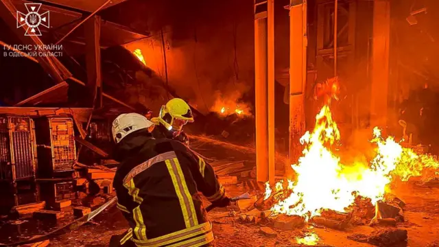 Firefighters tackle a blaze in Odesa following a missile attack