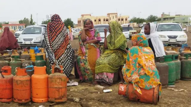 Sudanese wait for a gas truck to arrive to exchange their empty canisters, in Wad Madani, the capital of Sudan's al-Jazirah state - 14 June 2023